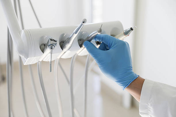 Professional Root Canal Treatment technician working in Huguley, AL